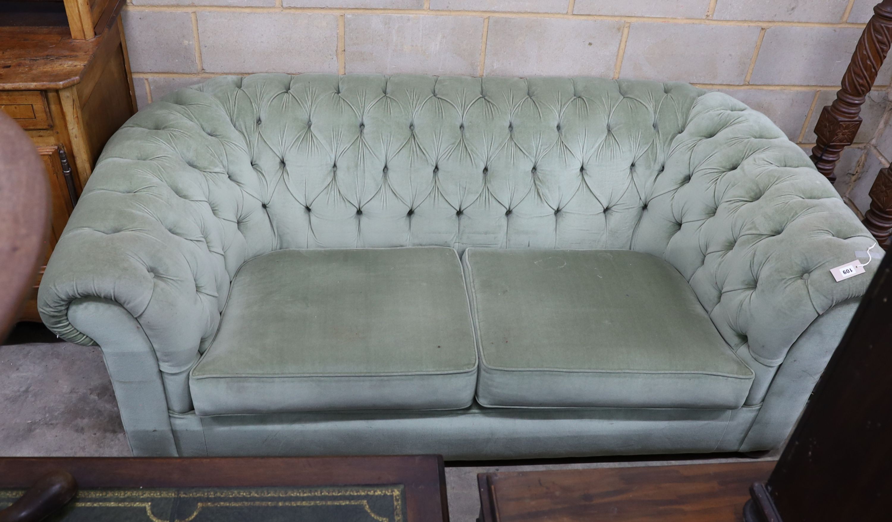 A Victorian style Chesterfield settee, upholstered in buttoned green dralon, width 204cm, depth 104cm, height 74cm